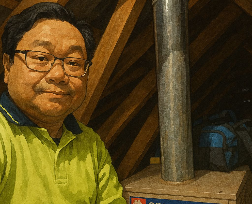 photo of Daivd Hiep Pham: working on in roof space with tool bag in background